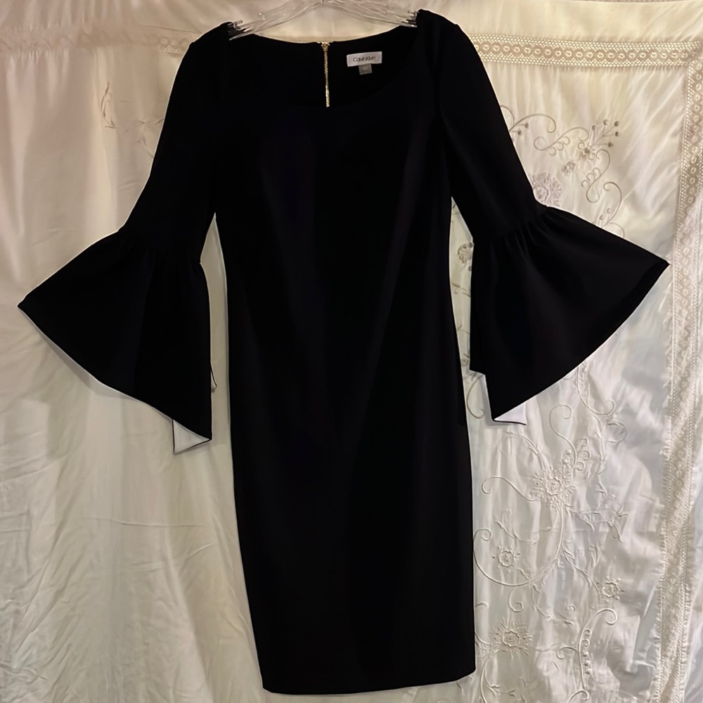 Vintage Calvin Klein size for black dress with puffy sleeves looks new